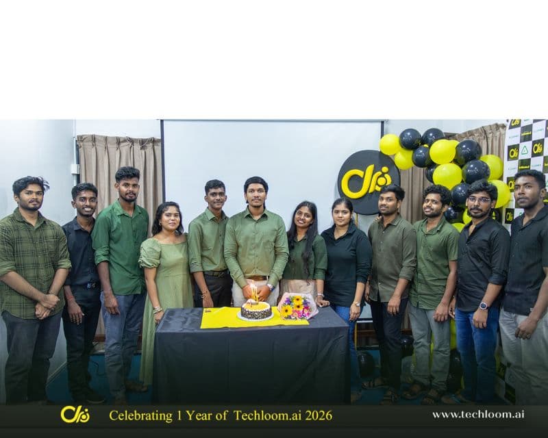 The Techloom.ai team gathered around the first anniversary cake